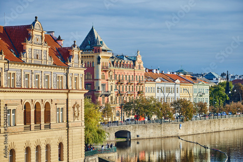 Historical architecture along the river Vltava in Prague during autumn.