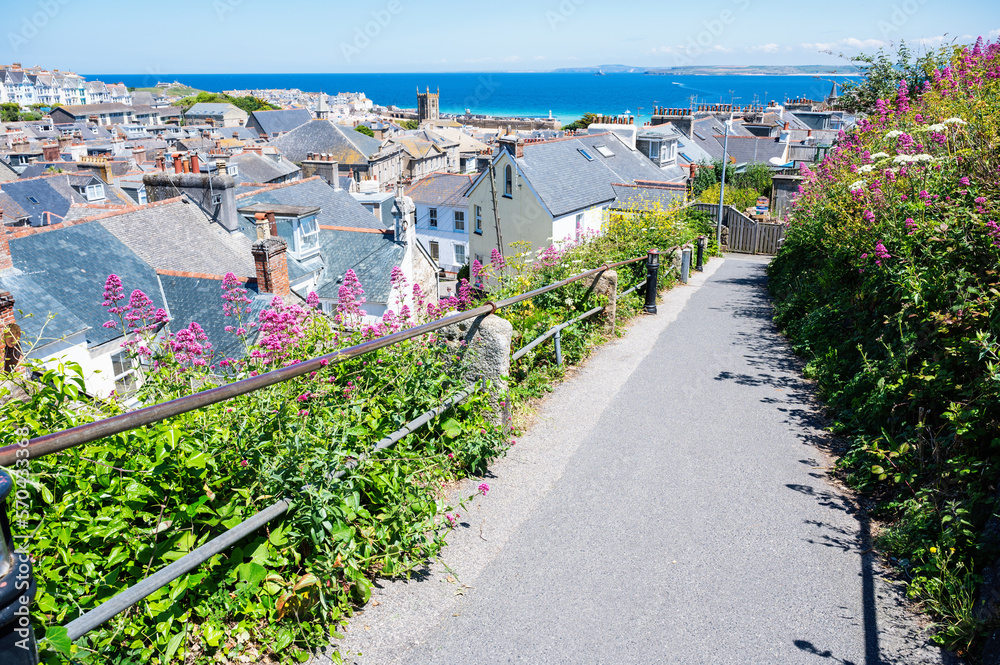 View of rooftops in St Ives, west Cornwall, South West England. Beautiful blue sea on the background. Selective focus