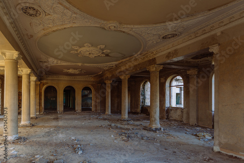 Large hall with columns in old abandoned mansion © Mulderphoto