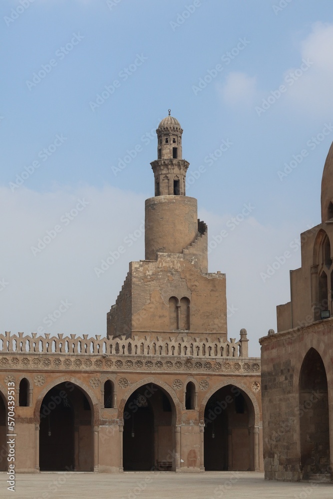 close up of Ibn Toulun Mosque's tower with clear blue sky in the morning.
