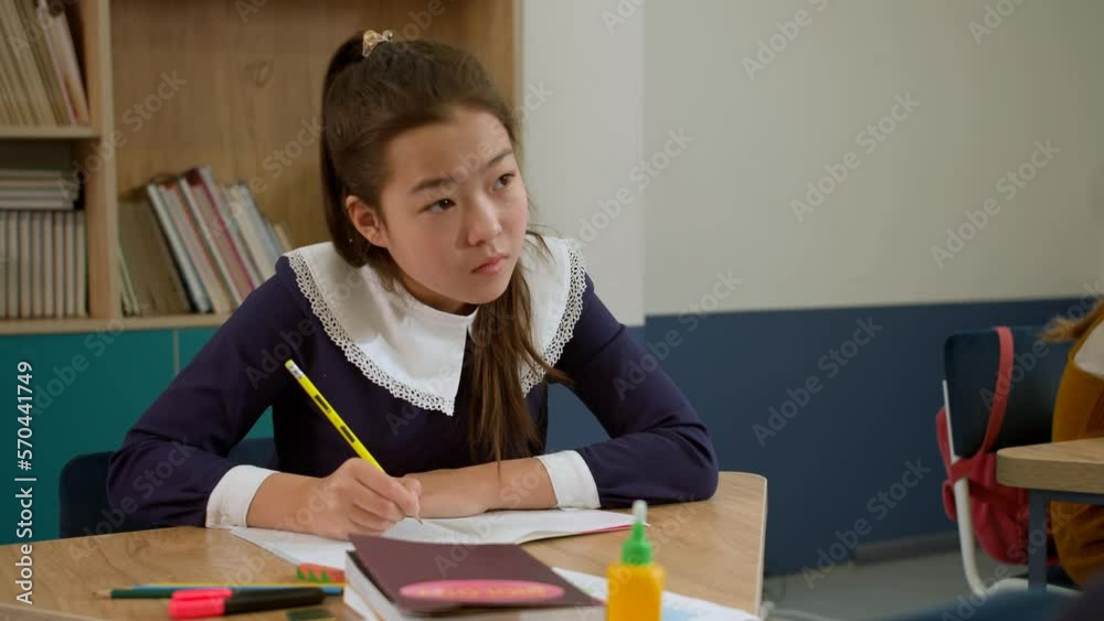 Elementary school class children communicate with the teacher answering question Elementary school class children communicate with the teacher answering question