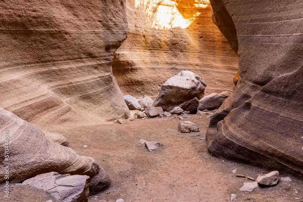 Escape to the nature - slot canyon with some rocks on the ground Escape to the nature - slot canyon with some rocks on the ground