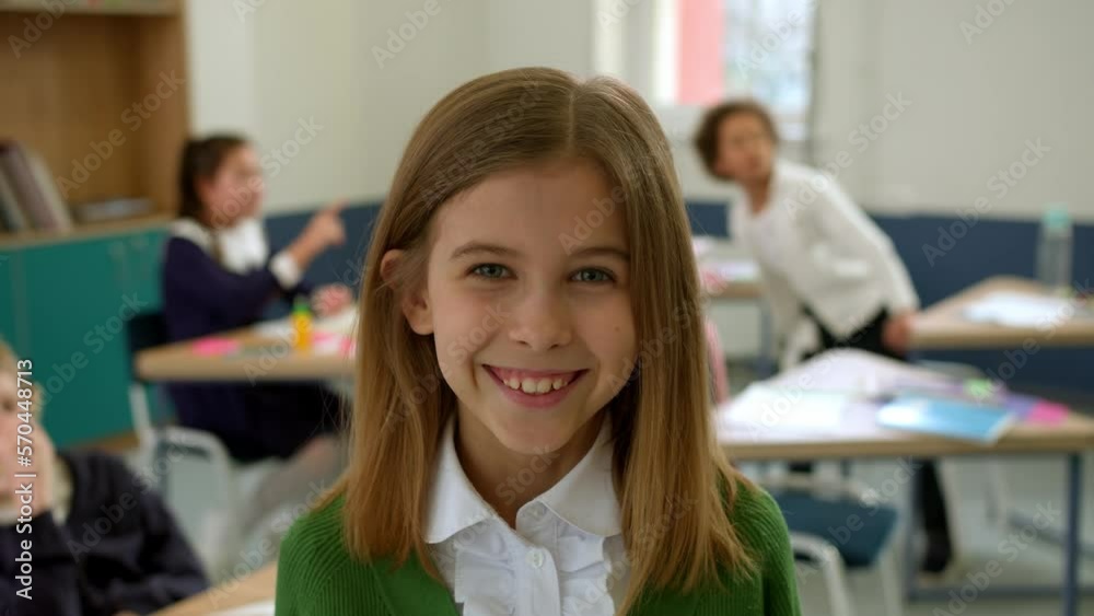 Elementary school class children communicate with the teacher answering question Elementary school class children communicate with the teacher answering question