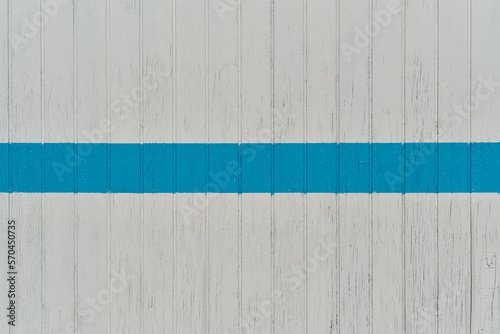 white wooden wall with blue line with copy space