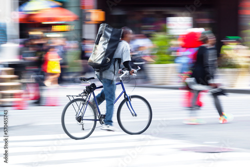 bicycle messenger on the move in the city