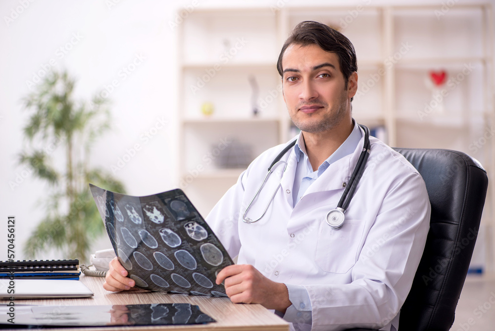 Young male doctor radiologist working in the clinic Young male doctor radiologist working in the clinic