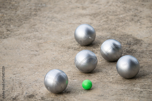 Petanque balls in the playing field with shady as a backdrop.