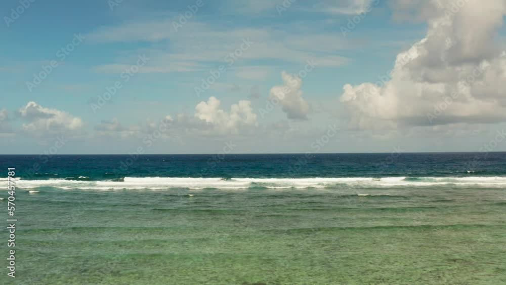 Seascape: blue ocean and surf waves crashing on a coral reef top view. Summer and travel vacation concept Seascape: blue ocean and surf waves crashing on a coral reef top view. Summer and travel vacation concept
