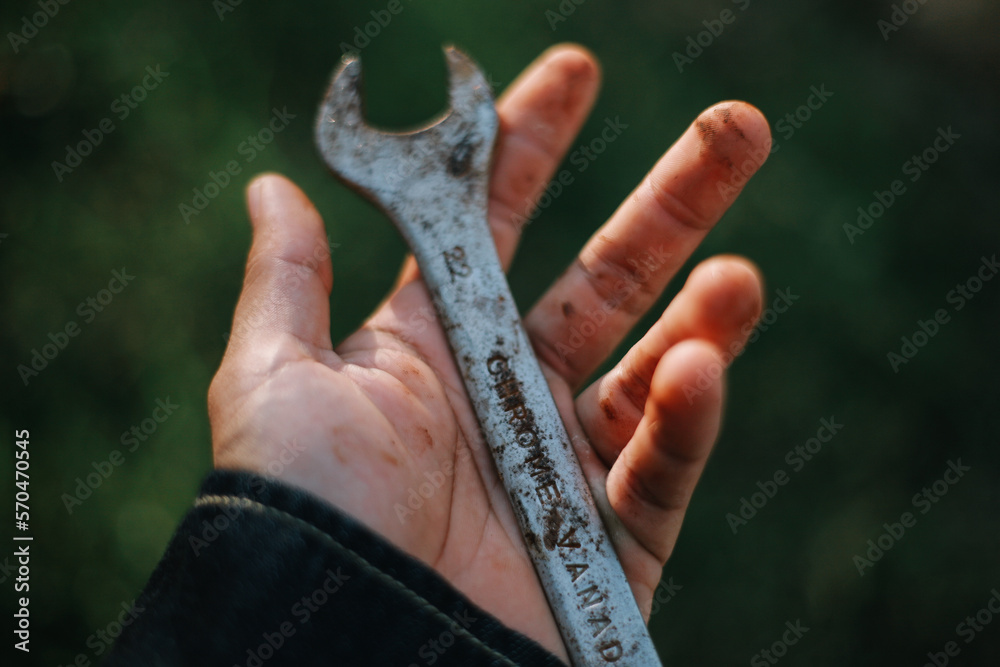 holding rusty spanner