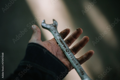 holding rusty spanner