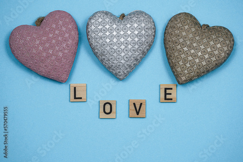 Composition for Valentine's day. Celebrating Valentine's. Flat lay style, top view. Saint Valentine day background with gift box and various red hearts and red roses