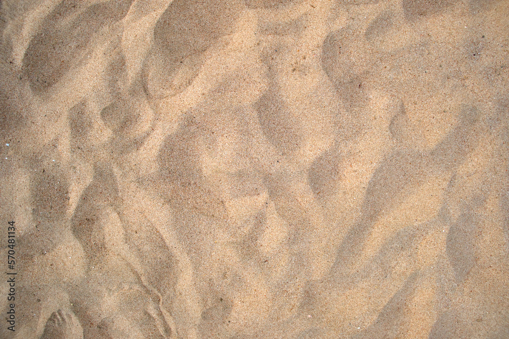 Flat view of clean yellow sand surface covering seaside beach. Sandy texture - obrazy, fototapety, plakaty 