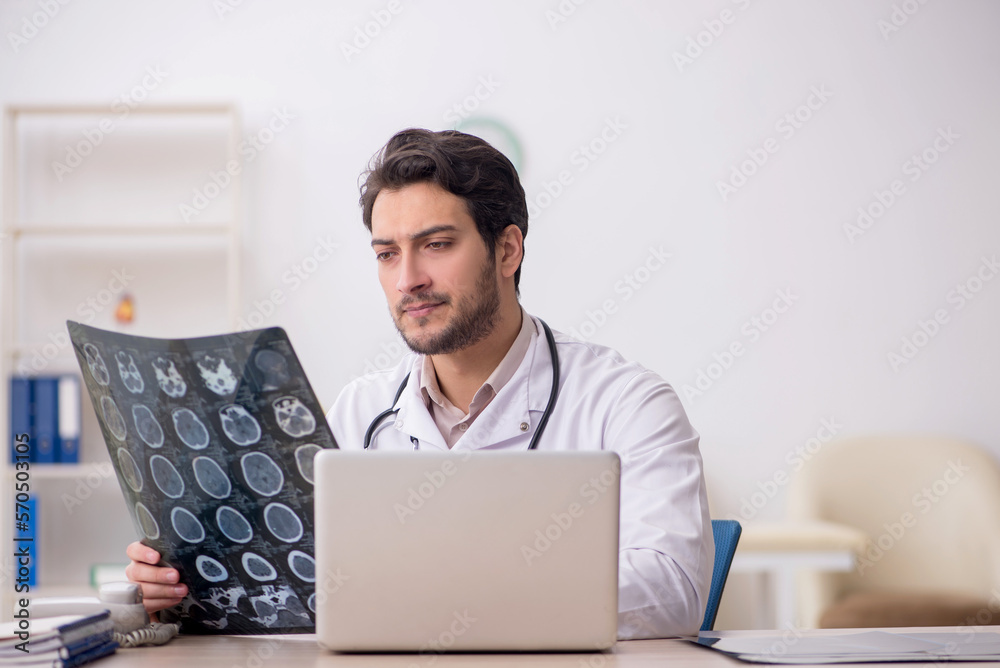 Young male doctor radiologist working in the clinic Young male doctor radiologist working in the clinic