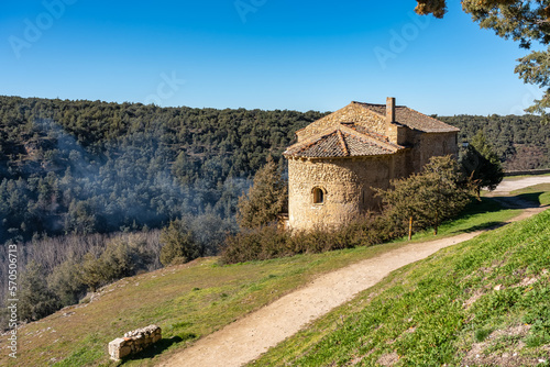 Small stone house in the forest next to a dirt road near the medieval village of Pedraza, Segovia.