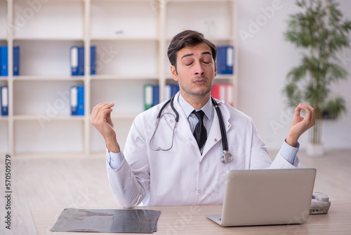 Young male doctor working in the clinic