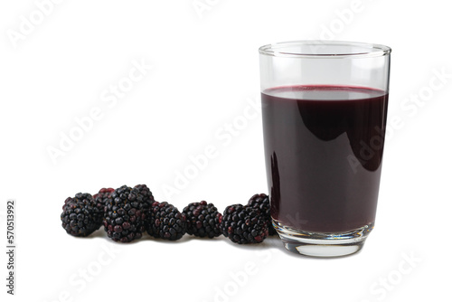 Blackberry juice in a clear glass with fresh berries next to it , isolated on white background with clipping path