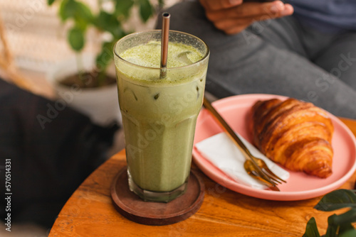 Wallpaper Mural Green Tea Latte and croissant on the wooden table. Torontodigital.ca