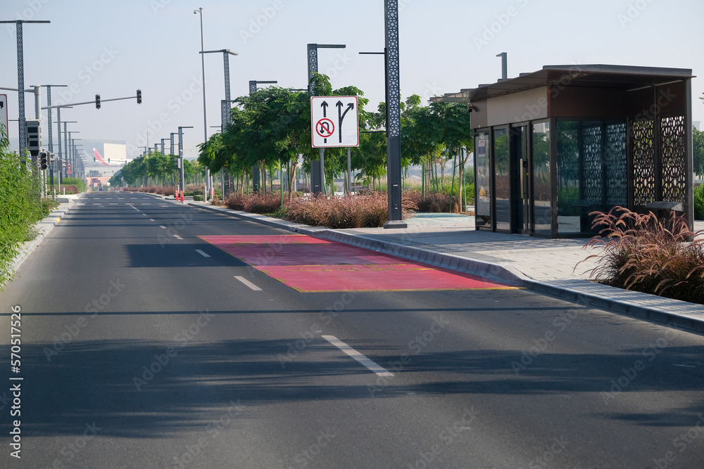 View of an empty road in a modern city, a stylish bus stop on the street, markings on the public transport road