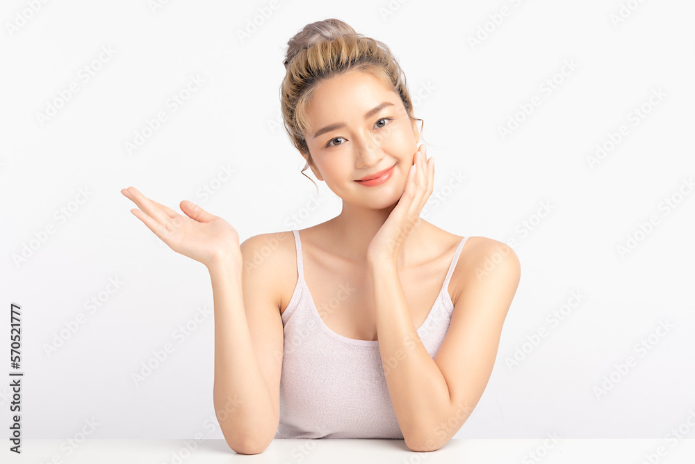 Happy beautiful asian woman showing empty copy space on the open hand. Asian girl beauty face skincare and health wellness, Facial treatment, Isolated on white background.
