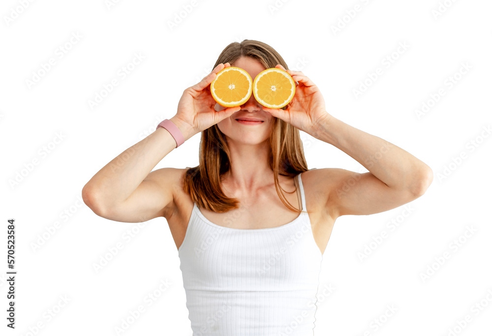 Young woman preparing tasty lemonade in kitchen. Detox diet. Healthy Nutrition. Holding orange halves near eyes Young woman preparing tasty lemonade in kitchen. Detox diet. Healthy Nutrition. Holding orange halves near eyes