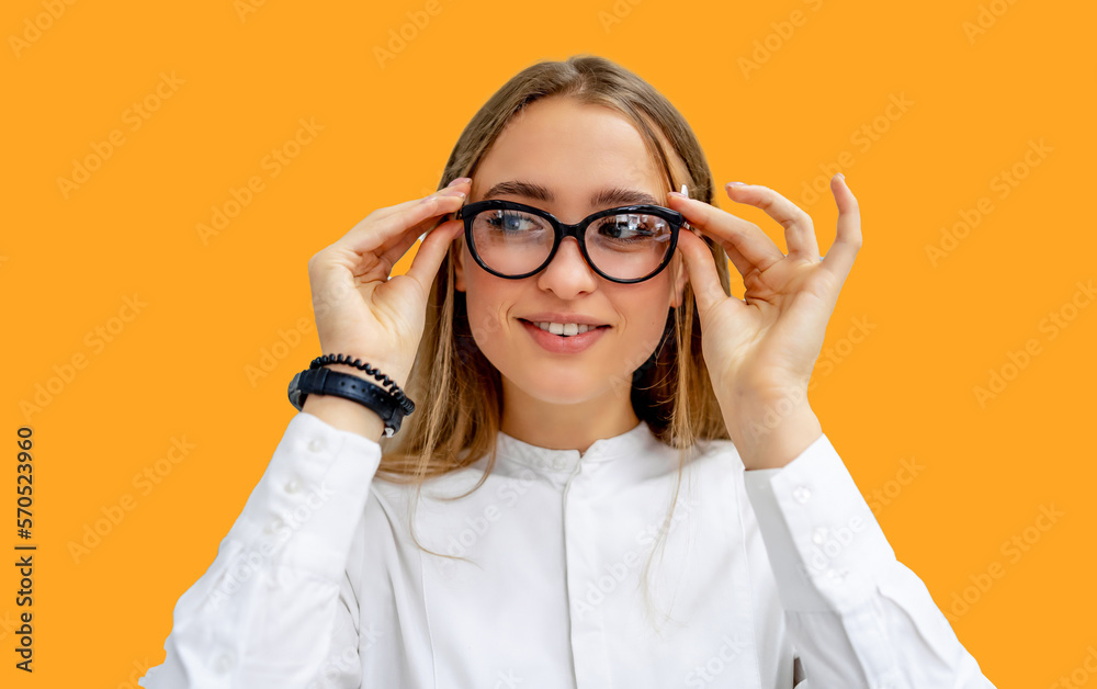 Row of glasses at an opticians. Eyeglasses shop. Stand with glasses in the store of optics. Woman's hand gives glasses to a man. Presenting spectacles