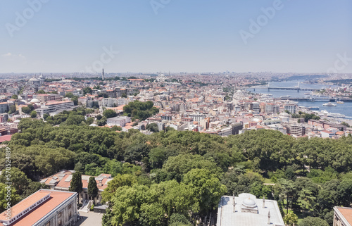 Top view of the old city of Istanbul and the Bosphorus, in the foreground low-rise buildings, against the backdrop of city hills, on a warm summer day