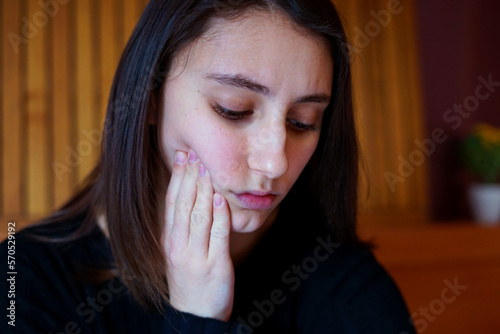 Young woman with toothache. Tooth pain concept.
