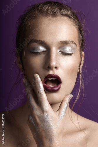 Close up beauty portrait of young woman with mouth open photo