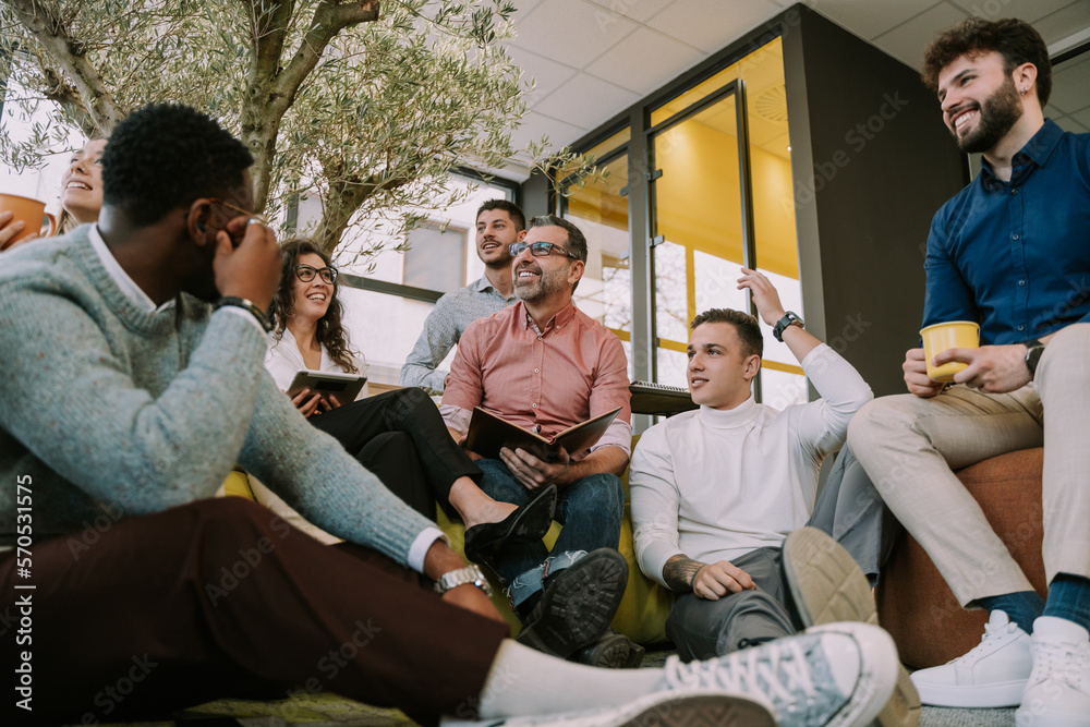 Smiling diverse colleagues coworking at modern office Smiling diverse colleagues coworking at modern office