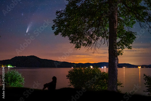 Woman views the comet Neowise over Vermont's Lake Bomoseen photo