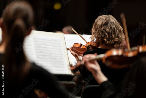 A view of a violin player in a classical symphony orchestra concerts