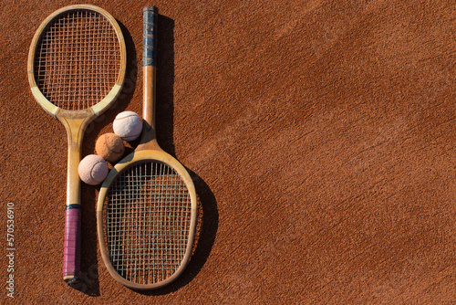 old tennis rackets and balls , old school 
