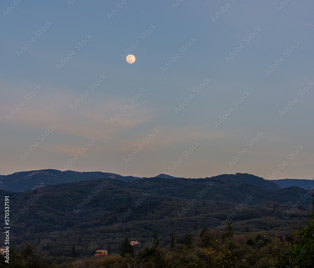 mountain landscape on a winter night. view of the winter scenery in full moon light mountain landscape on a winter night. view of the winter scenery in full moon light