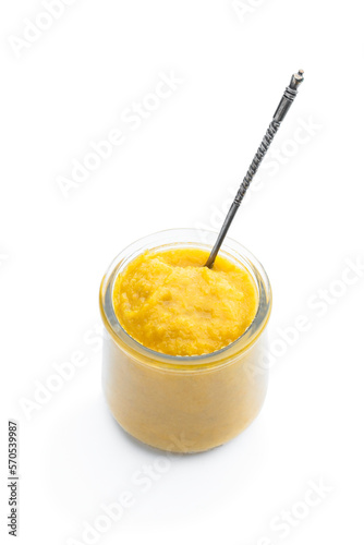 Vegetable puree in a glass jar isolated on white