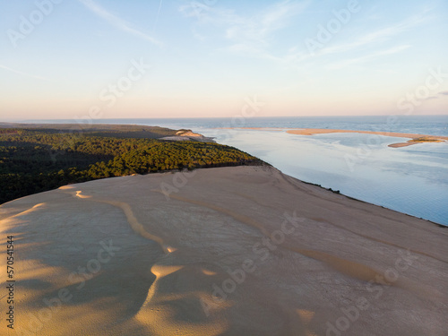 Sunset aerial view of Dune du Pilat with atlantic ocean and pine forest in Arcachon France