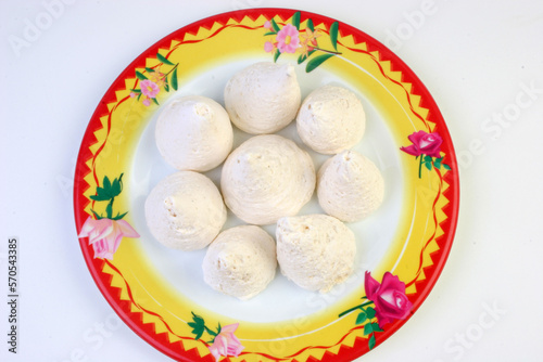Momos shape Sweet Dishes on a plate with white background. photo