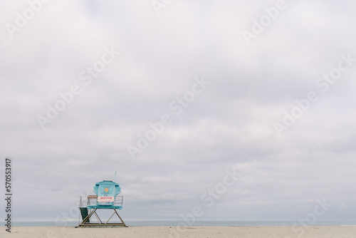 Fine art beach scene with lifeguard Tower and cloudy skies