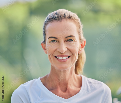 Happy, sports and portrait of a woman in tennis for training, fitness and cardio competition on a court in France. Motivation, exercise and face of a mature sport player standing for a match