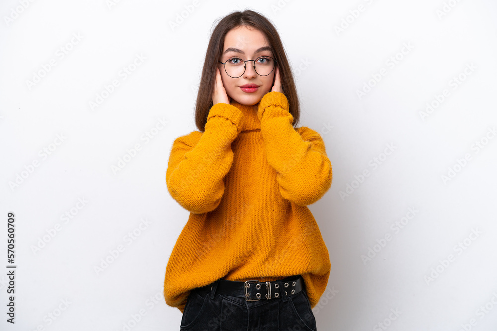 Young Ukrainian woman isolated on white background frustrated and covering ears Young Ukrainian woman isolated on white background frustrated and covering ears