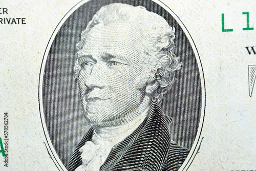 The portrait of Alexander Hamilton, who served as the first U.S. Secretary of the Treasury from the obverse side of old 10 $ ten American dollars bill banknote series 1988, old vintage American money photo