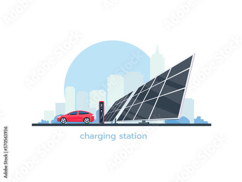 Electric car is charging. Charging station and solar panels on the background of the cityscape.