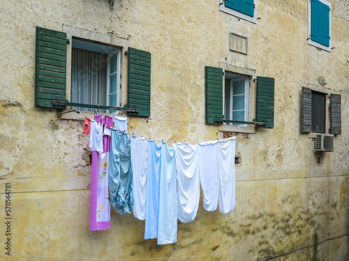 Colourful clothes on building washing line © david melrose