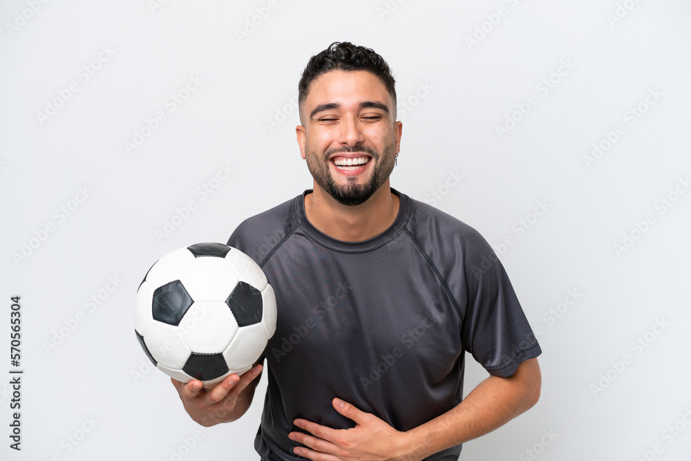 Arab young football player man isolated on white background smiling a lot Arab young football player man isolated on white background smiling a lot