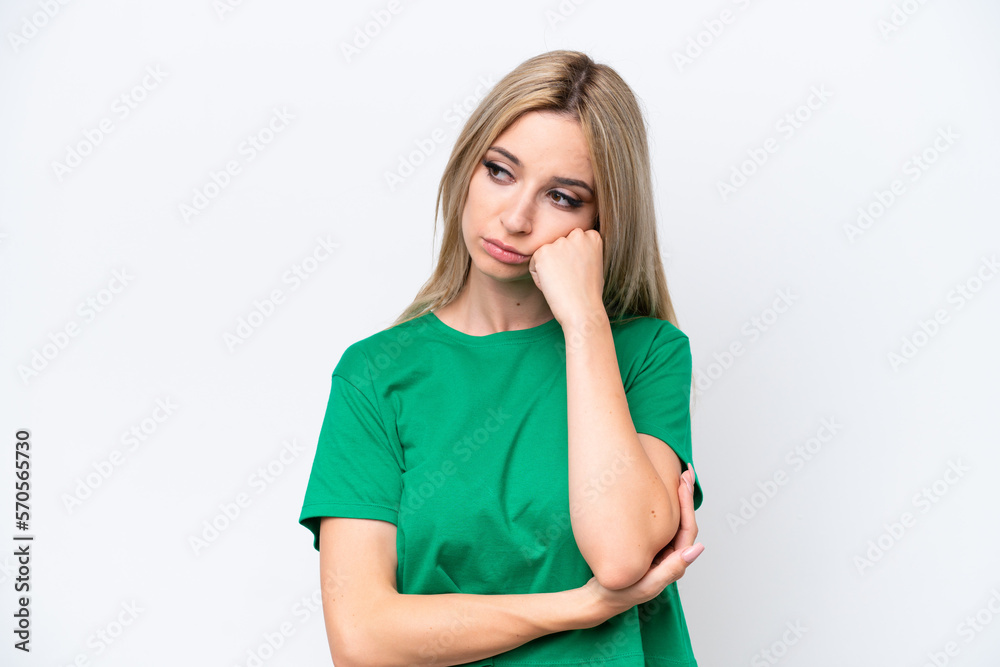 Pretty blonde woman isolated on white background with tired and bored expression Pretty blonde woman isolated on white background with tired and bored expression