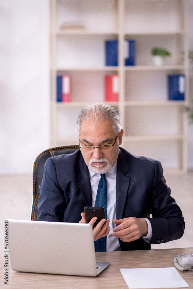 Old male employee and too much work in the office Old male employee and too much work in the office