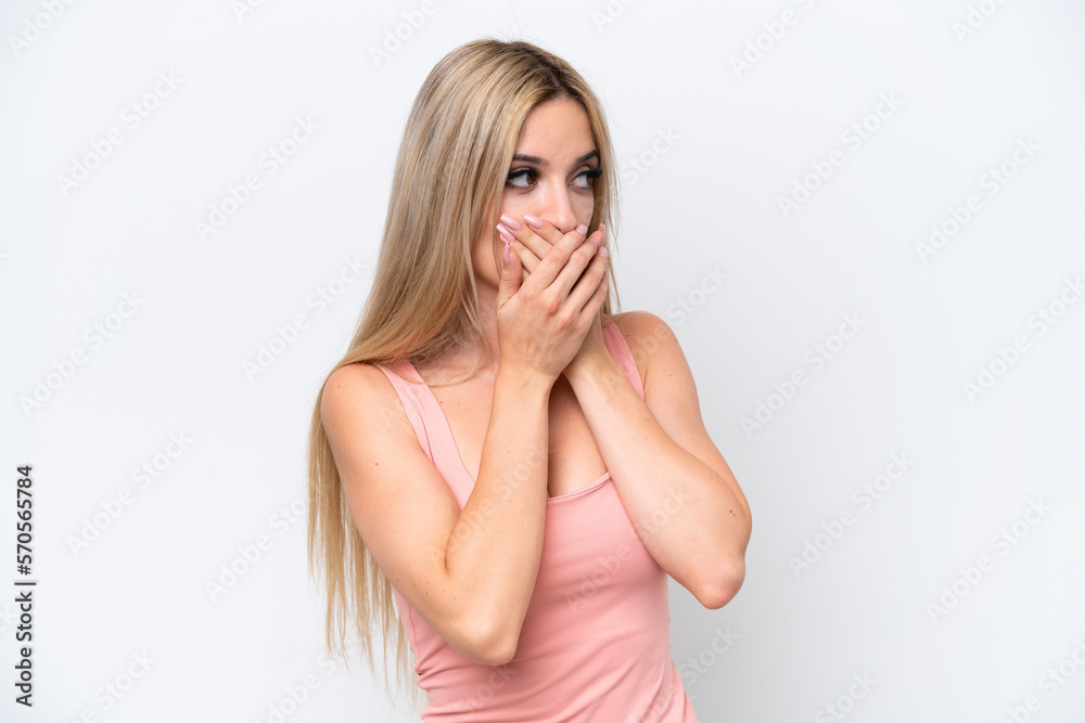 Pretty blonde woman isolated on white background covering mouth and looking to the side Pretty blonde woman isolated on white background covering mouth and looking to the side
