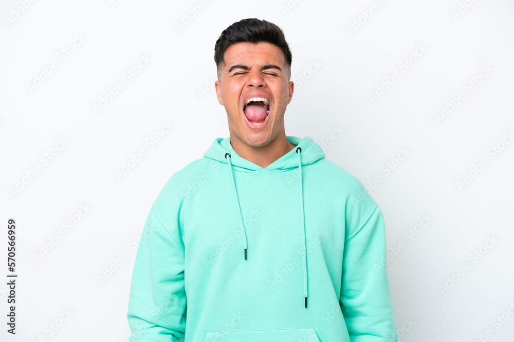 Young caucasian handsome man isolated on white background shouting to the front with mouth wide open Young caucasian handsome man isolated on white background shouting to the front with mouth wide open