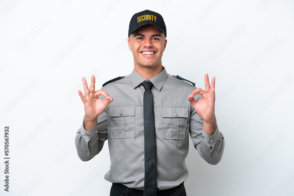 Young caucasian security man isolated on white background showing an ok sign with fingers Young caucasian security man isolated on white background showing an ok sign with fingers
