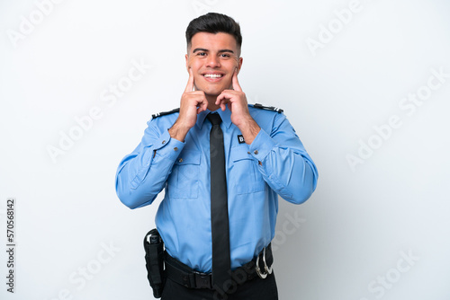 Young police caucasian man isolated on white background smiling with a happy and pleasant expression © luismolinero