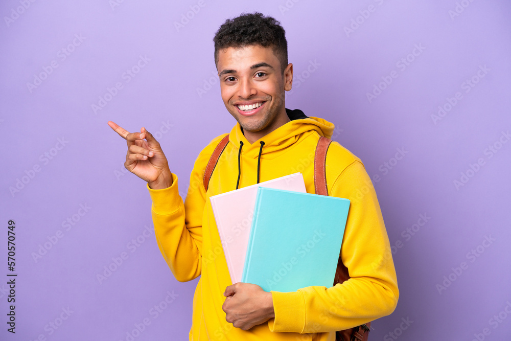 Young student Brazilian man isolated on purple background pointing finger to the side Young student Brazilian man isolated on purple background pointing finger to the side
